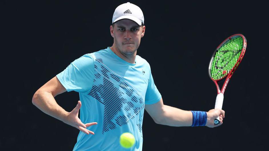 Henry Patten prepares to play a forehand