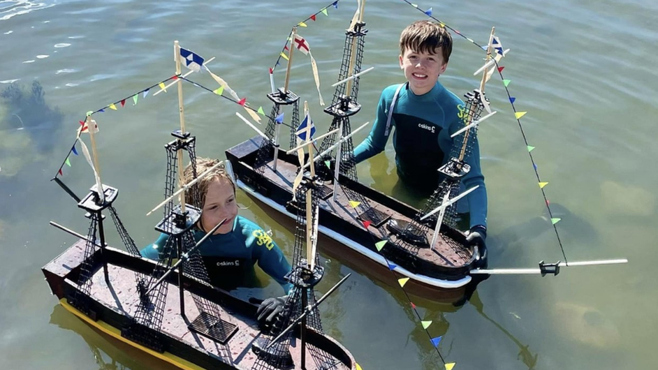 The brothers with their boats