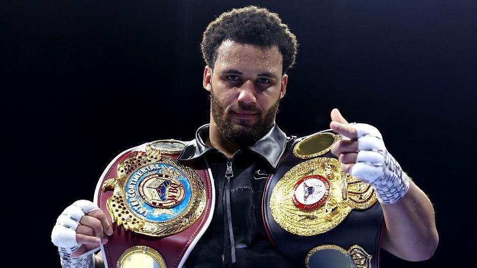 Moses Itauma poses with his title belts after beating Jermaine Franklin Jr in March 2026