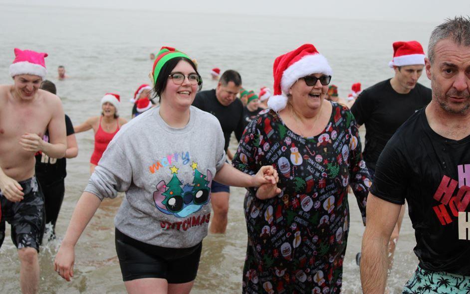 People walking out of the North Sea at Felixstowe