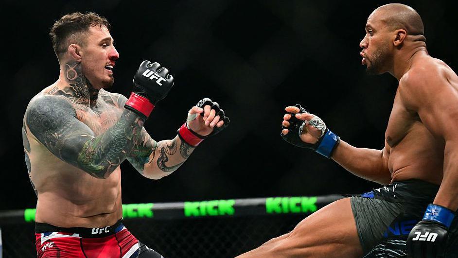 Ciryl Gane delivers a low kick to Tom Aspinall during their bout in UFC 321 in Abu Dhabi