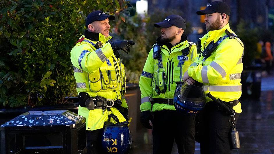 Three police officers in Manchester, ahead of the UEFA Europa League fixture between Manchester United and Rangers