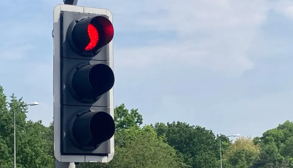 Generic road traffic light show red for stop.