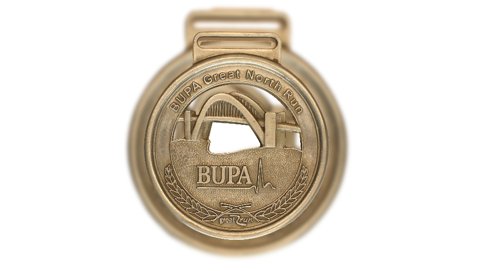 A light gold circular medal that reads Bupa Great North Run at the top, and then Bupa again at the bottom. It has the Tyne bridge on.
