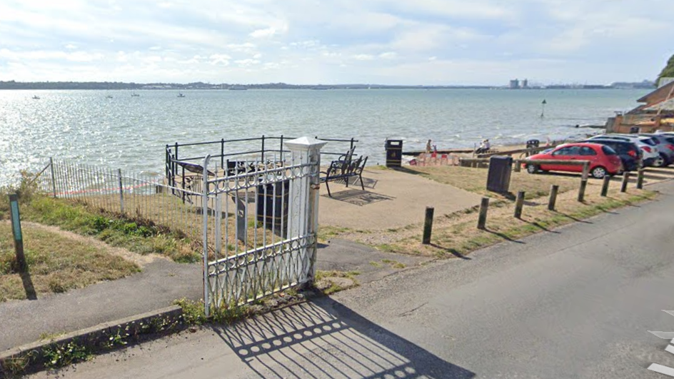 The Hard on Victoria Road - a small concrete area with park benches looking out over Southampton Water