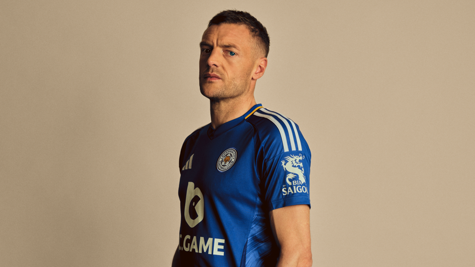 Vardy looking down the barrel of a camera lens in a photoshoot while dressing in a Leicester shirt