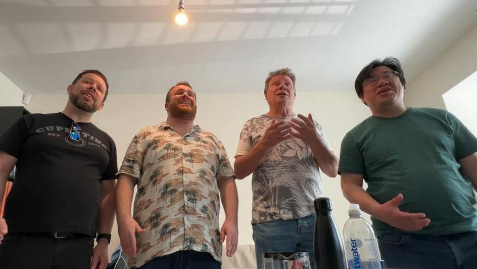 A barbershop quartet singing