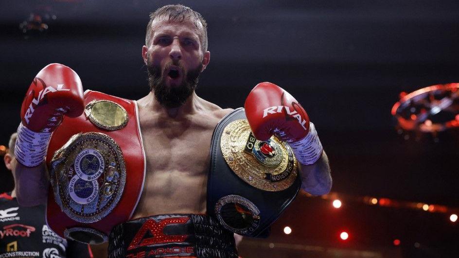 Anthony Cacace holding both belts post-fight 