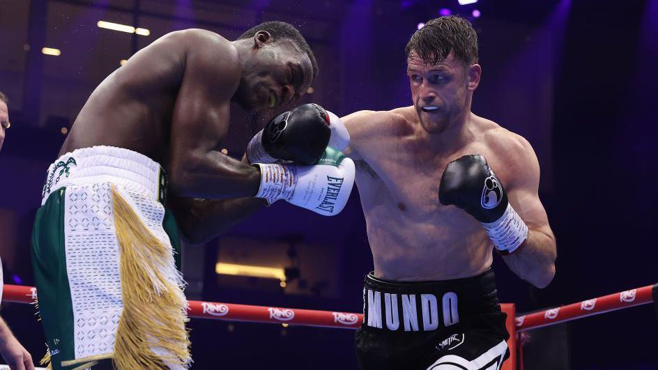 Callum Smith lands a close    hook against Joshua Buatsi