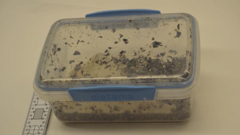 A photograph of a sealed box containing a substance taken from police evidence