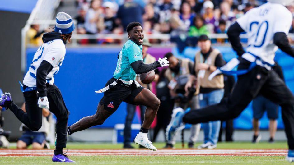 Tyreek Hill running with the ball during the 2024 Pro Bowl flag football game