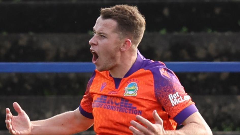 Kyle McClean celebrates scoring Linfield's third goal against Coleraine