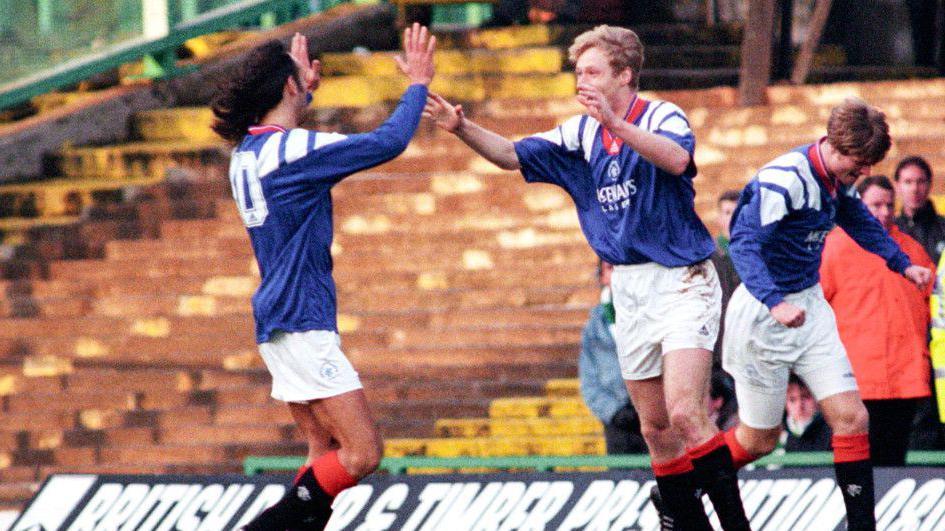 Aleksey Mikhailitchenko celebrates with Mark Hateley after scoring at Celtic Park in 1994