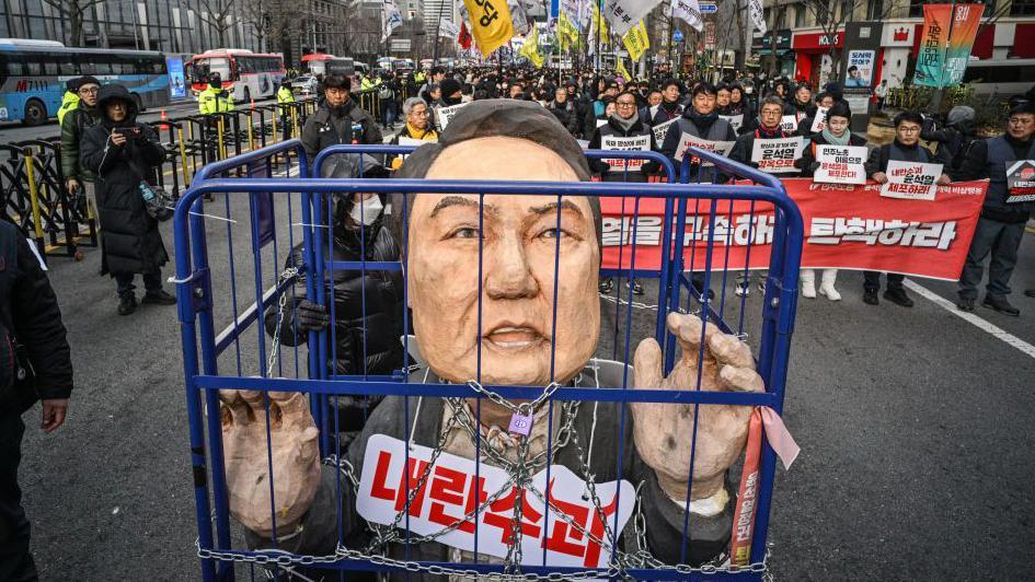 Demonstrators outside Seoul's City Hall on 12 Dec call for President Yoon Suk Yeol to be removed 