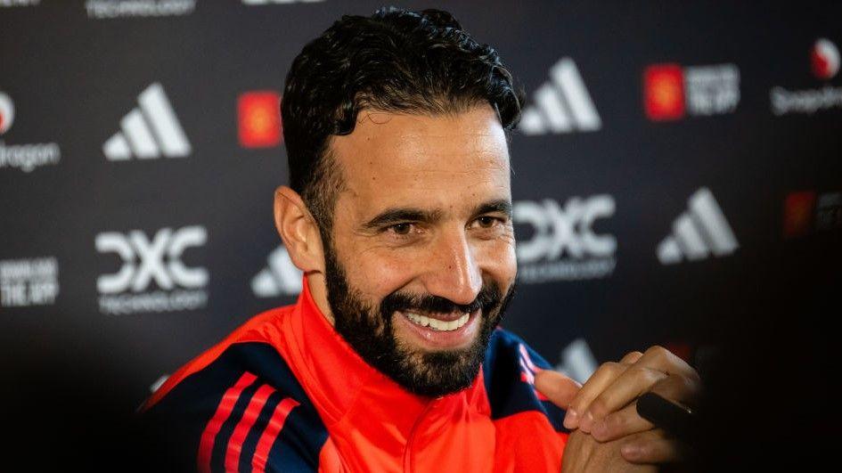 New Manchester United head coach Ruben Amorim smiles during a news conference