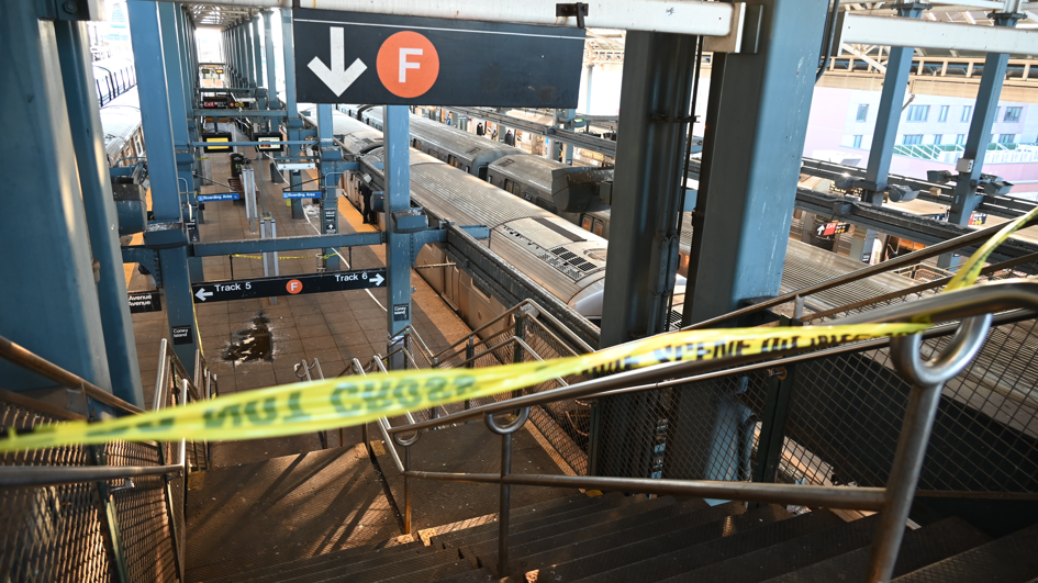 Police investigate at the Coney Island-Stillwell Avenue Station in Brooklyn after a woman aboard a subway car was set on fire and died