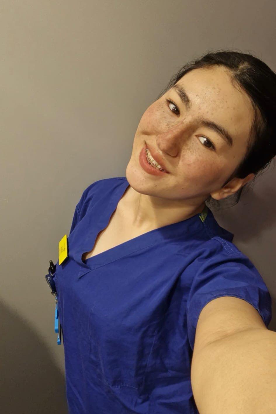Pervin is wearing a nursing uniform