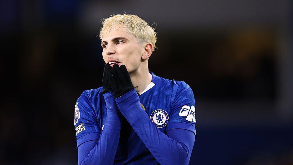 Alejandro Garnacho looks rueful, with his hands on his chin