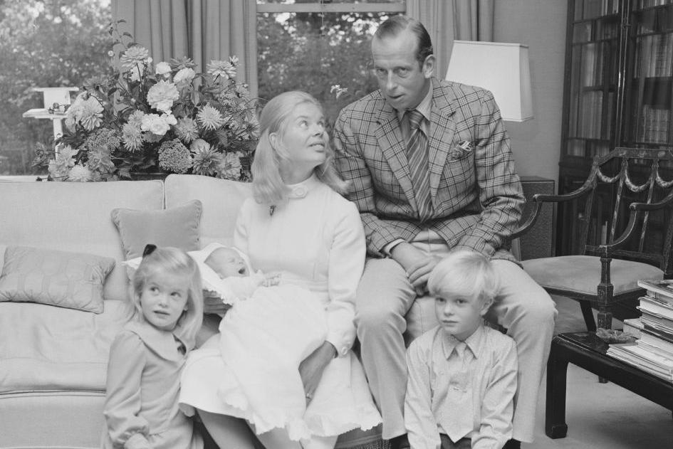 A black and white photo of The Duke and Duchess of Kent at home with their children: George, Helen and Nicholas
