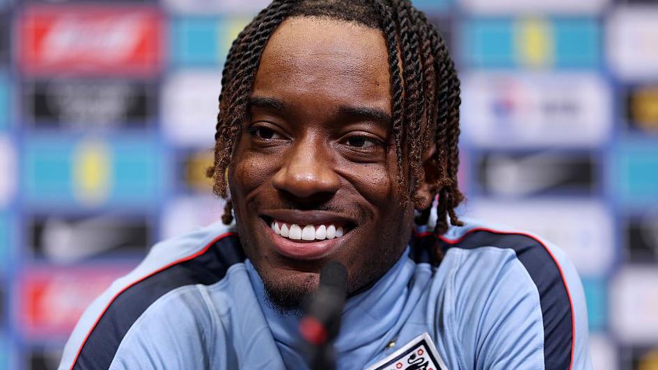 Noni Madueke speaks at an England press conference