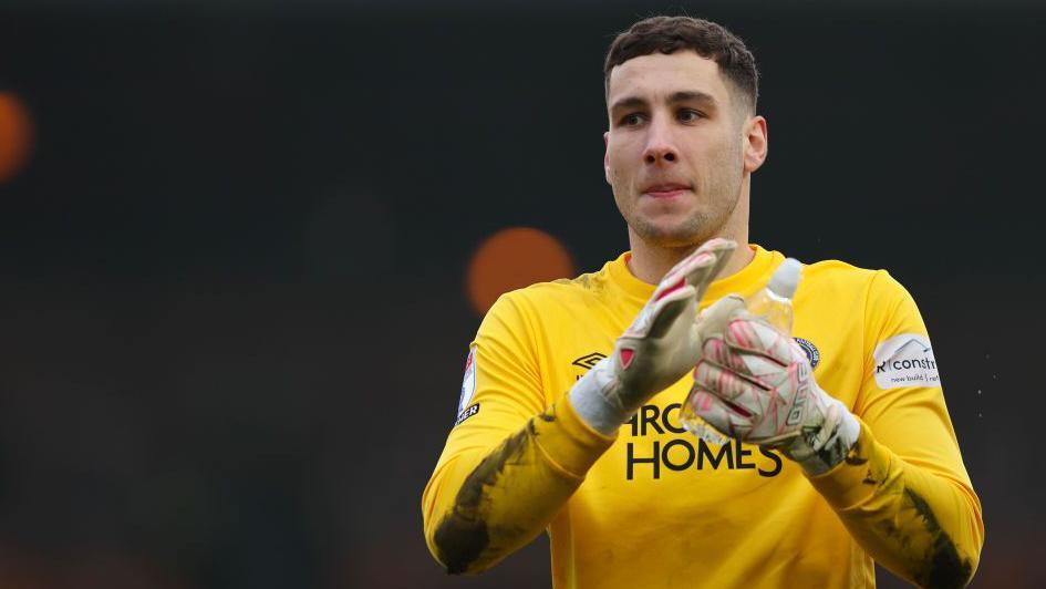 Marko Marosi in his yellow goalkeeper's shirt