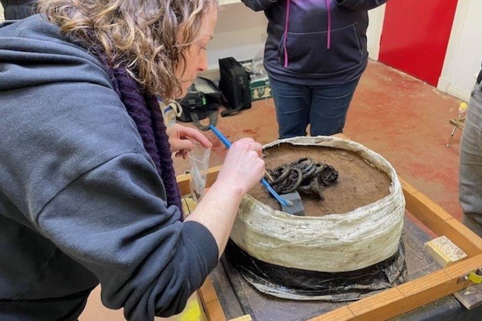 Rachel Buckley examining the hoard