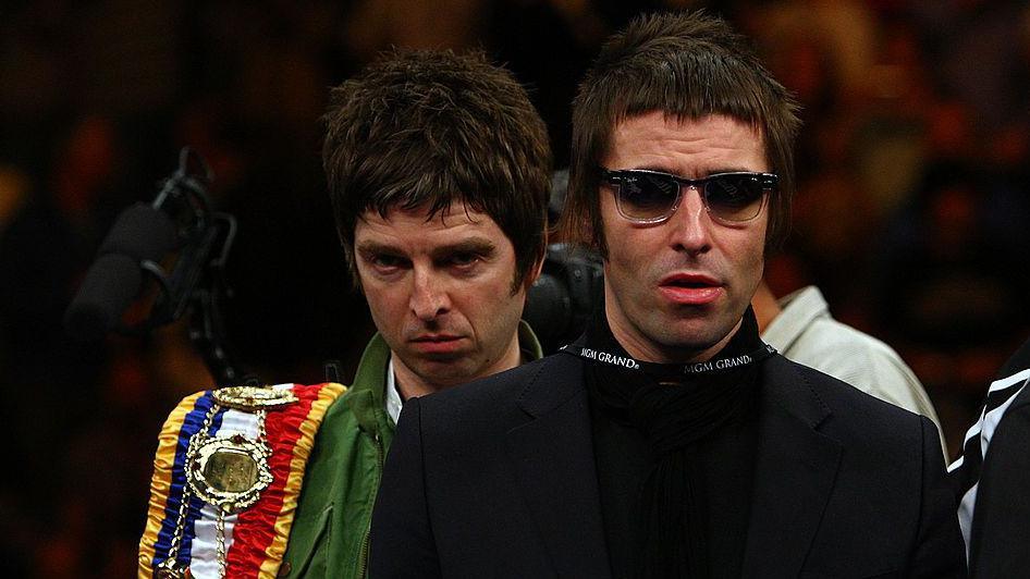 Liam and Noel Gallagher of Oasis carry Ricky Hatton's belts into the ring before his fight against Paulie Malignaggi at the MGM Grand Garden Arena in Las Vegas in 2008