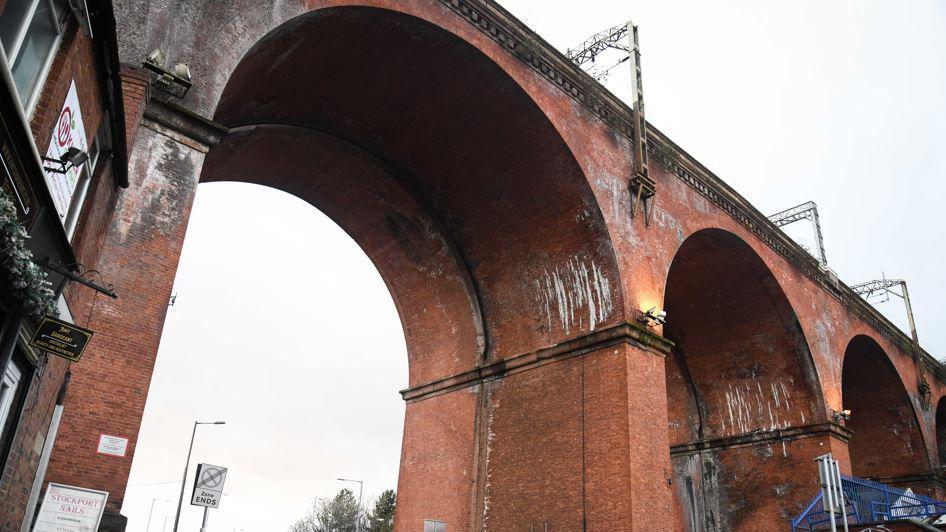 Stockport Viaduct, a red brick Victorian structure with several arches