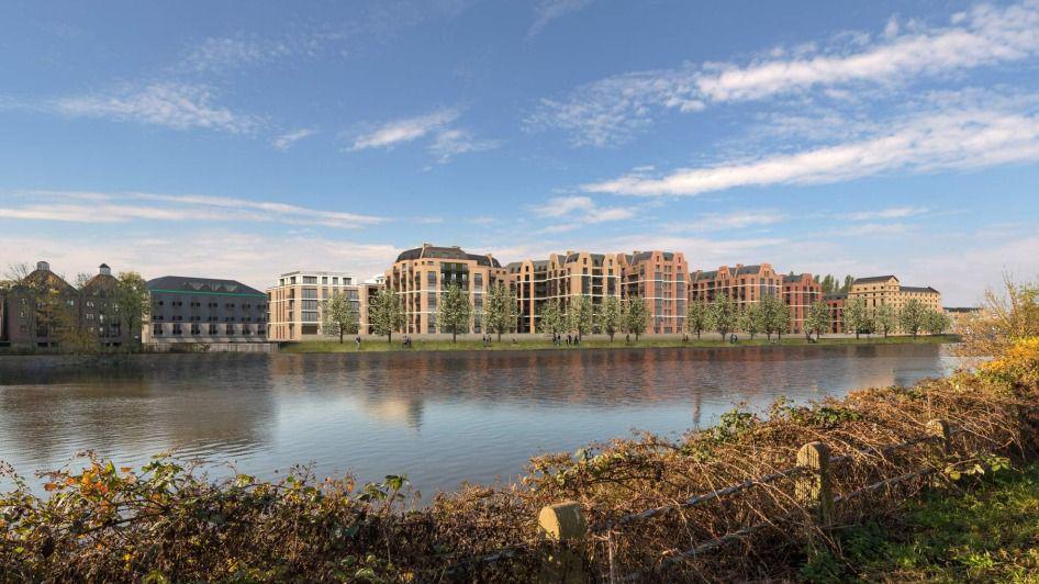 A CGI showing multiple proposed brick buildings as seen from the opposite river bank of the Thames