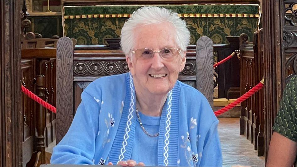 Lucille Terry smiling in a church