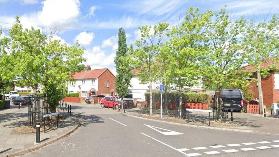 Google Maps image of Borland Avenue showing houses and several parked cars.