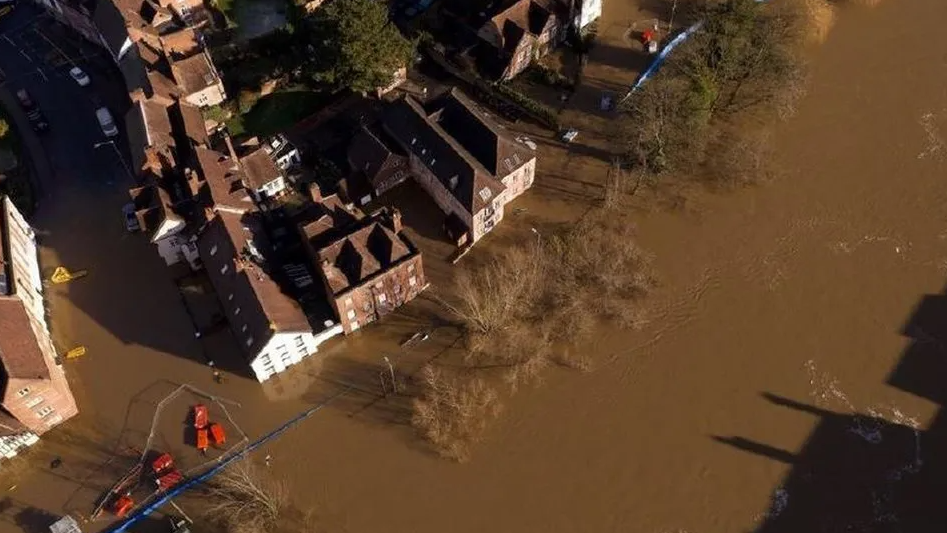 Brown flood water has risen up around properties in Bewdley in 2021 - this is an aerial view 