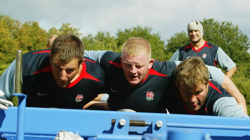 Dorian West prepares to pack down with Julian White and Jason Leonard in 2003