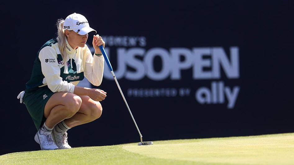 Charley Hull lines up a putt
