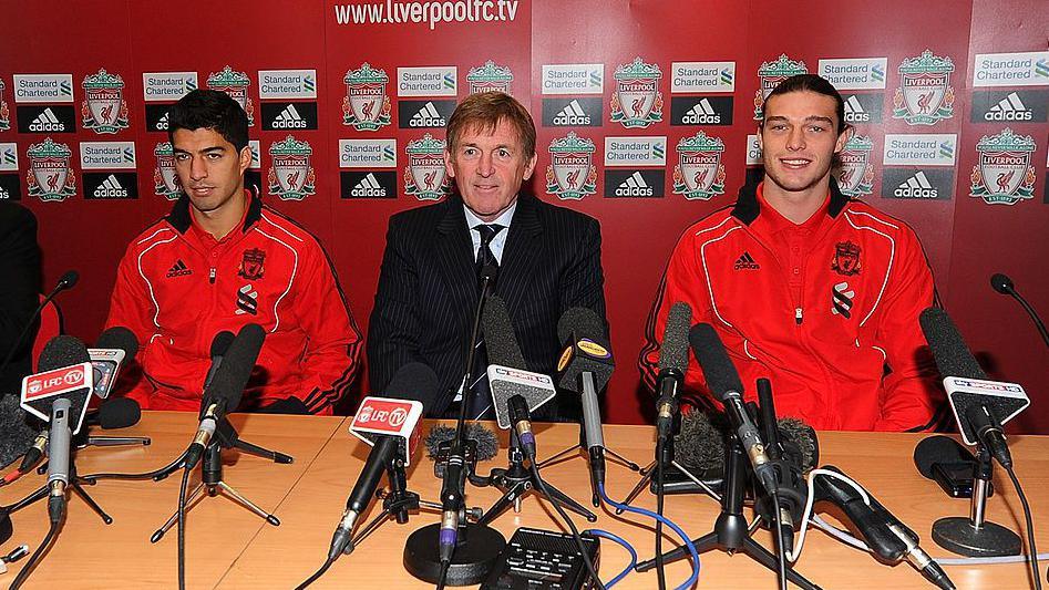 Andy Carroll and Luis Suarez of Liverpool attend a press conference with manager Kenny Dalglish at Anfield on February 3, 2011 