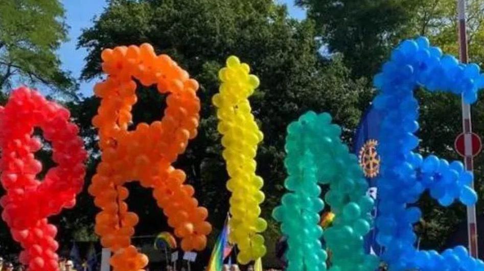 A colourful balloon display which spells out the word pride