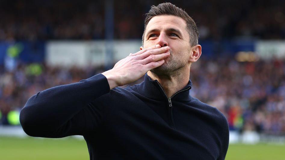 Portsmouth head coach John Mousinho blows a kiss to the crowd