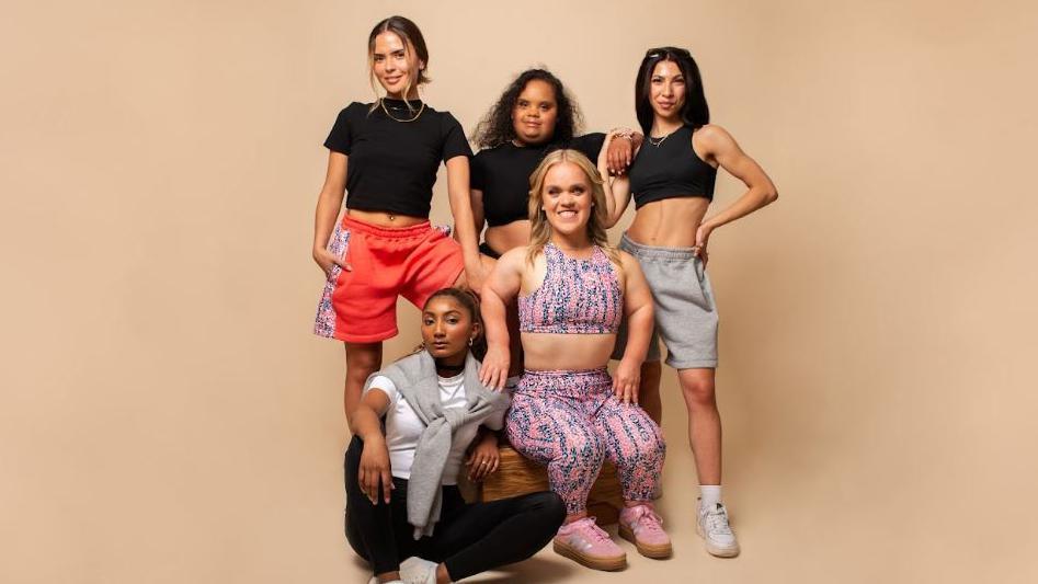 A group of women all wearing sportswear 