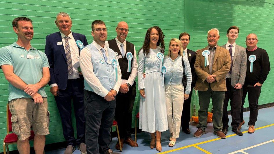 Reform UK candidates at the Derbyshire County Council election count in a sports hall