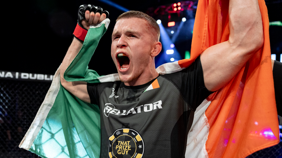 Paul Hughes celebrates with the Irish flag 