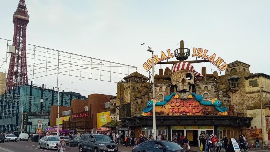 Coral Island amusement centre Blackpool promenade with Blackpool Tower in the background