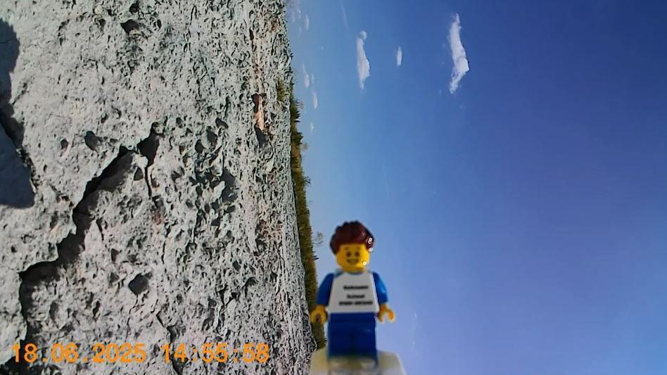 Dan the Lego man lying sideways back on Earth.