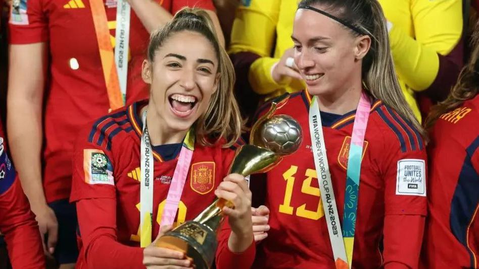 Olga Carmona captain of Spanish team holds the Women's World Cup trophy after winning in 2023.