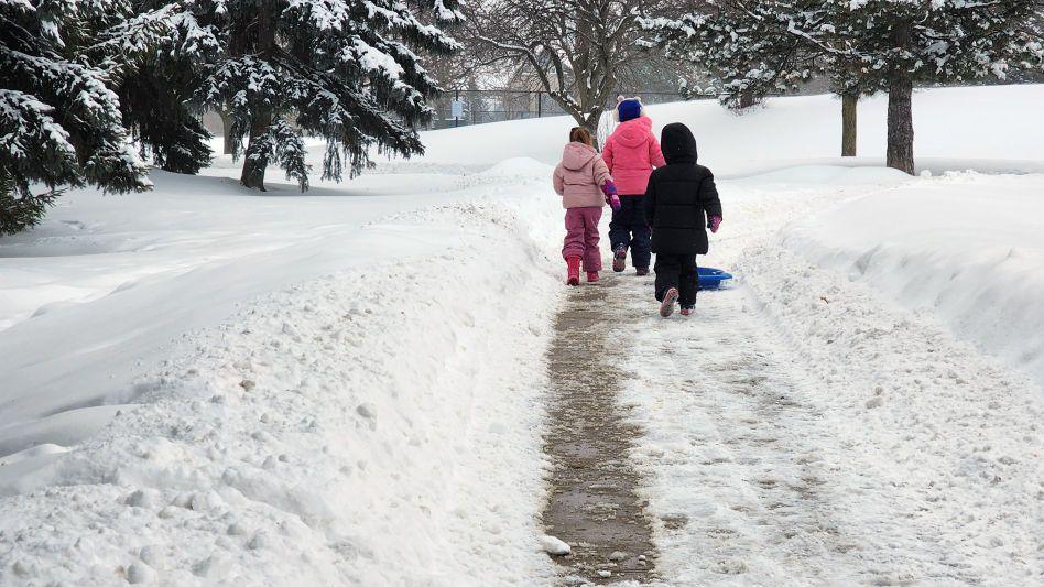 Children going to play in the snow in Toronto following two storms