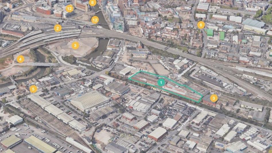 A 3D map showing the location of the planned apartments. There is a long rectangular shape beside the canal which indicates where the apartments will be built. 
