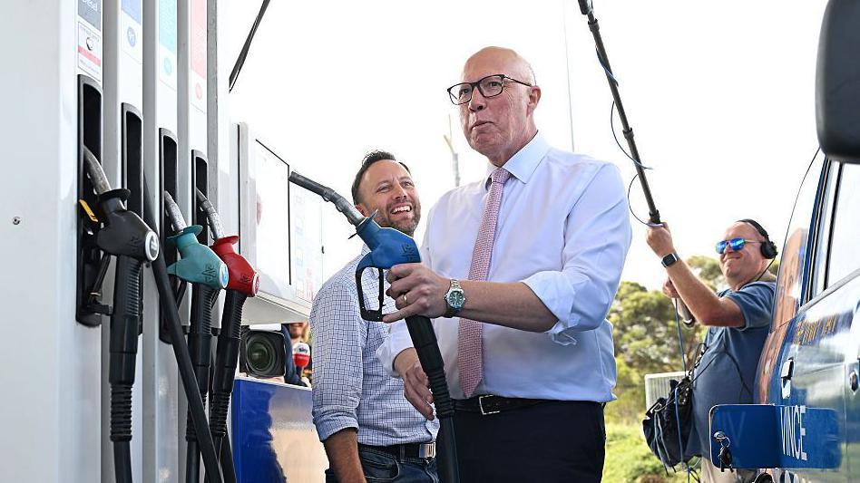 Opposition Leader Peter Dutton joined by Liberal candidate for Moore, Vince Connelly visit a fuel station in the electorate of Moore on May 02, 2025 in Perth, Australia.