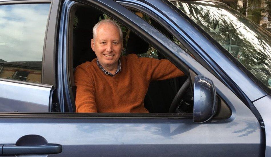 Picture of Robin in his car