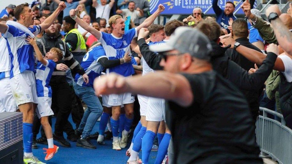 Birmingham celebrate their injury-time winner against Wigan on 31 August that took them top of League One