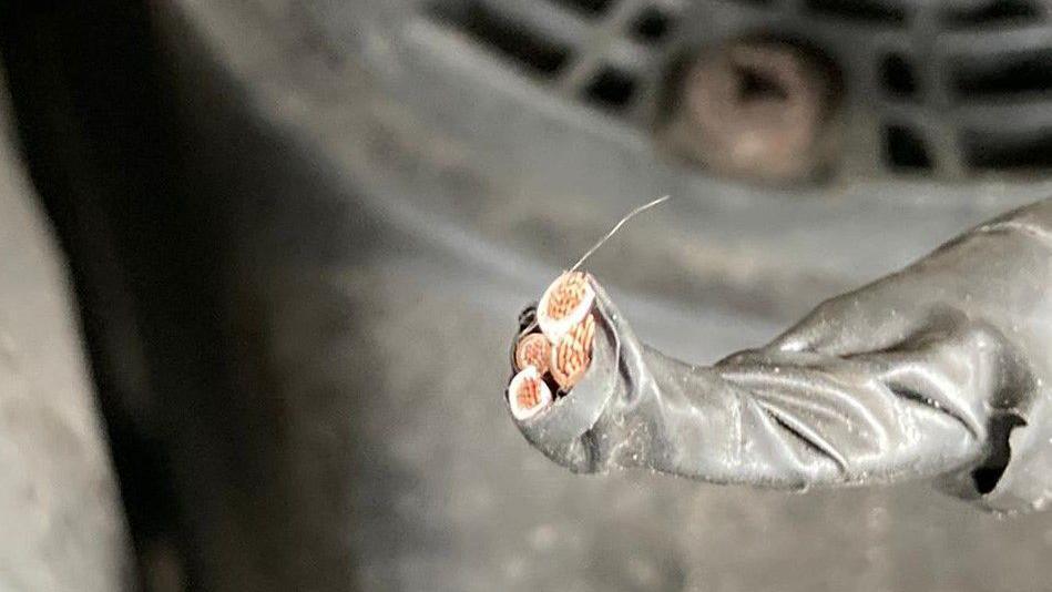 One of the wires cut from a bin lorry