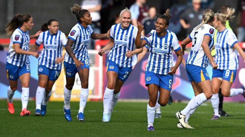 Nikita Parris celebrates with Brighton teammates after scoring against Aston Villa